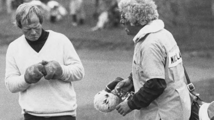 Jack Nicklaus cleans his golf ball as caddy Angelo Argea looks on in 1979. (Credit Columbus Citizen-Journal via Grandview Heights Public Library)
