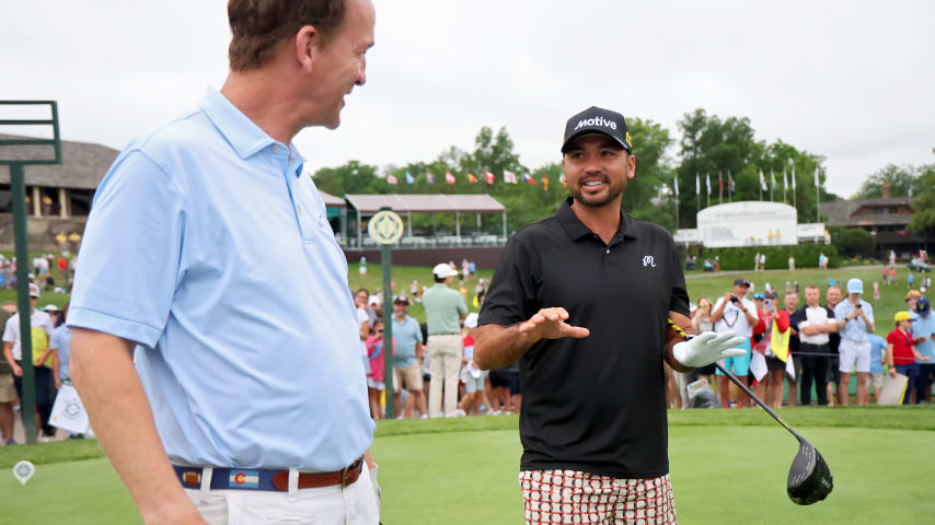 Peyton Manning and Jason Day meet on the 10th tee during the pro-am prior to the Memorial Tournament presented by Workday. (Michael Reaves/Getty Images)