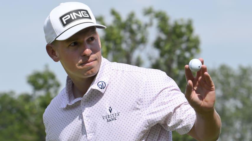 Sam Stevens acknowledges the cheers of the hometown crowd as he finishes in the lead during the third round of the Blue Cross and Blue Shield of Kansas Wichita Open. (Reed Hoffmann/Getty Images)