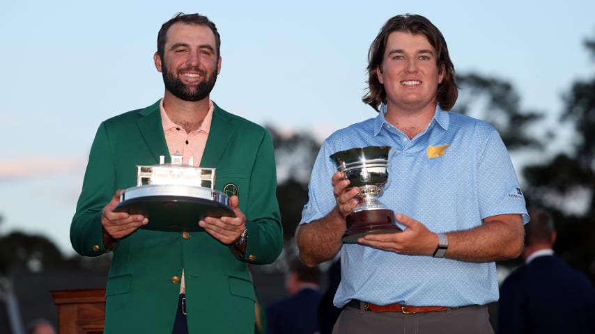 Scottie Scheffler poses and amateur Neal Shipley poses with the Silver Cup after winning low-amateur at the Masters. (Warren Little/Getty Images)