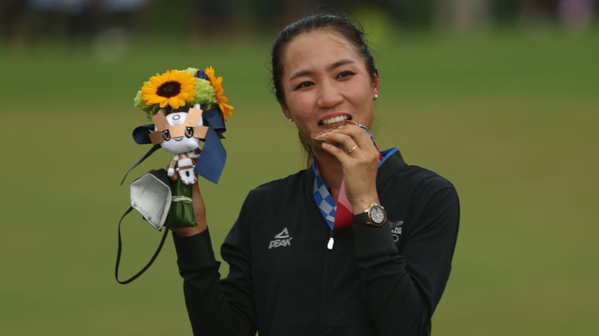 Lydia Ko of Team New Zealand celebrates with the silver medal at the victory ceremony after the final round of the Women's Individual Stroke Play on day fifteen of the Tokyo 2020 Olympic Games at Kasumigaseki Country Club on August 07, 2021 in Kawagoe, Japan. (Mike Ehrmann/Getty Images)