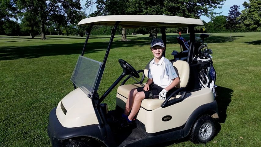 Young Parker driving the golf cart. (Courtesy Heidi Miklos)