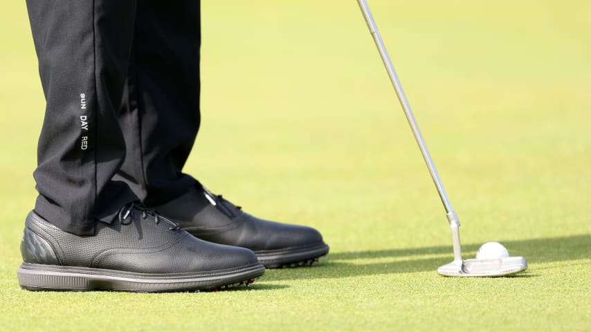 Tiger Woods putts with his traditional Scotty Cameron with added lead tape for this week at The Open at Royal Troon. (Kevin C. Cox/Getty Images)