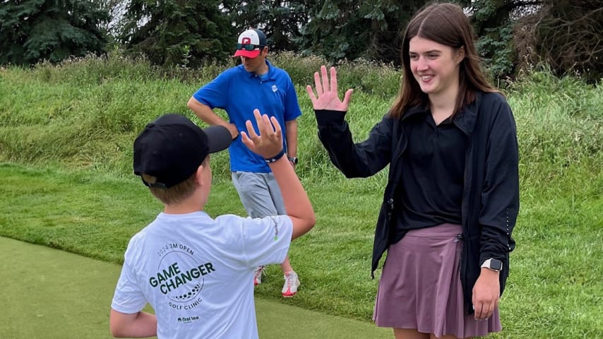 Lucia Halstrom spending time with kids who are a part of the First Tee - Minnesota program. (Credit Doug Milne)