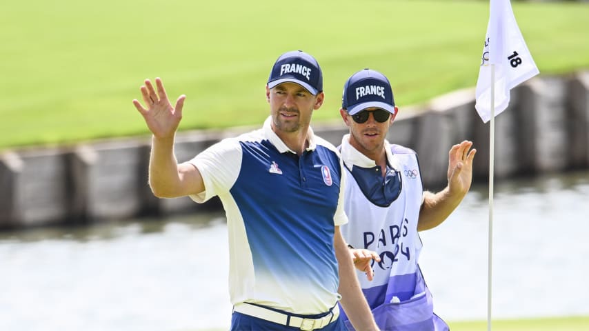 PARIS, FRANCE - AUGUST 01:  Victor Perez of Team France smiles and waves to fans after making a birdie putt on the 18th hole green during the first round of the Olympic men’s golf competition on day six of the Olympic Games Paris 2024 at Le Golf National on August 1, 2024 in Saint-Quentin-en-Yvelines, France. (Photo by Keyur Khamar/PGA TOUR via Getty Images)