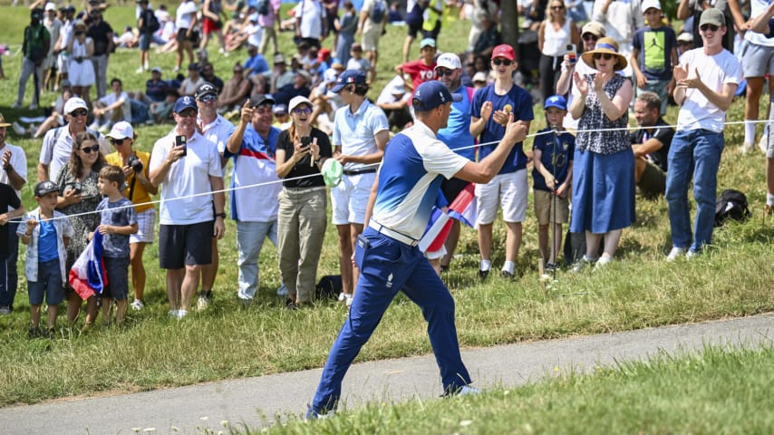 Victor Perez of Team France gives a thumbs up to French fans after making a birdie putt on the 18th hole green during the first round of the Olympic men’s golf competition. (Keyur Khamar/PGA TOUR)