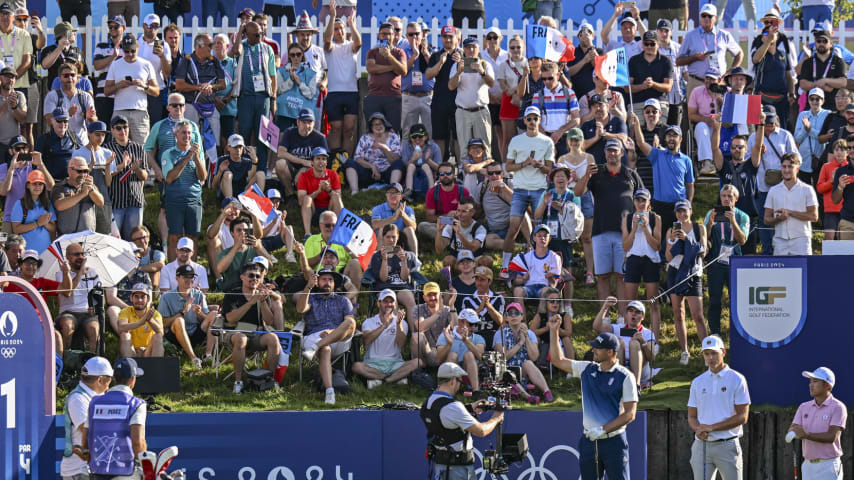 Victor Perez of Team Trance fist bumps to the crowd during the first round of the Olympic men’s golf competition. (Keyur Khamar/PGA TOUR)