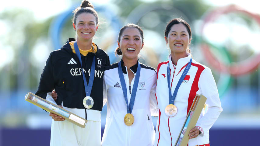 Gold medalist, Lydia Ko of Team New Zealand (C), silver medalist, Esther Henseleit of Team Germany (L) and bronze medalist, Janet Xiyu Lin of Team China (R) pose on the podium after the 2024 Paris Olympics. (Andrew Redington/Getty Images)