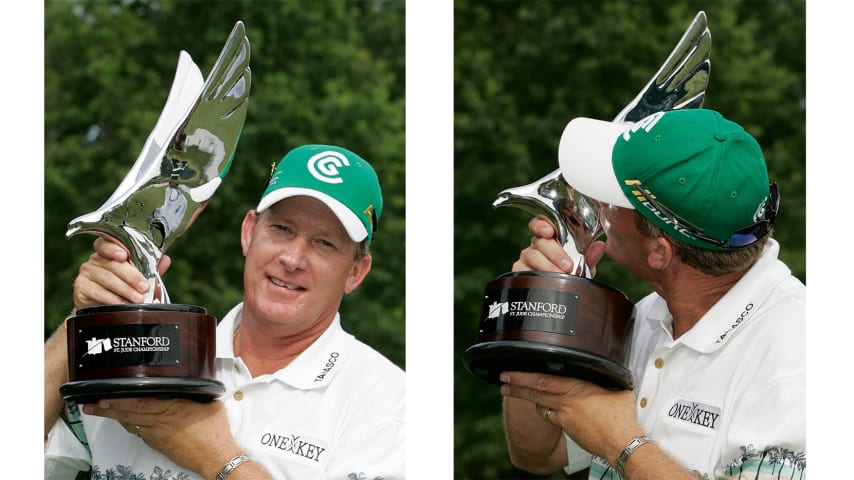 Woody Austin poses with the trophy after his win at TPC Southwind. (Stan Badz/PGA TOUR)