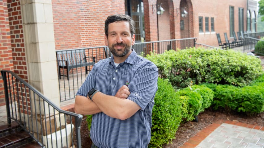 Andrew Green, the architect behind the East Lake renovation, posing in font of the clubhouse. (Kate Awtrey)