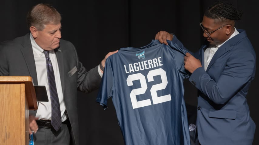 During the scholarship announcement, FSCJ College President John Avendano, Ph.D., awarded Laguerre with an Honorary Associate in Science degree in Cybersecurity. Along with a custom jersey, the degree was presented to family members in attendance. (Courtesy of Duval County Public Schools)