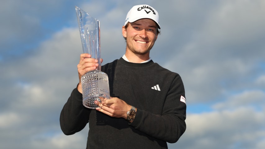 Rasmus Højgaard poses as he celebrates with the trophy after winning the Amgen Irish Open 2024 at Royal County Down Golf Club. (Luke Walker/Getty Images)