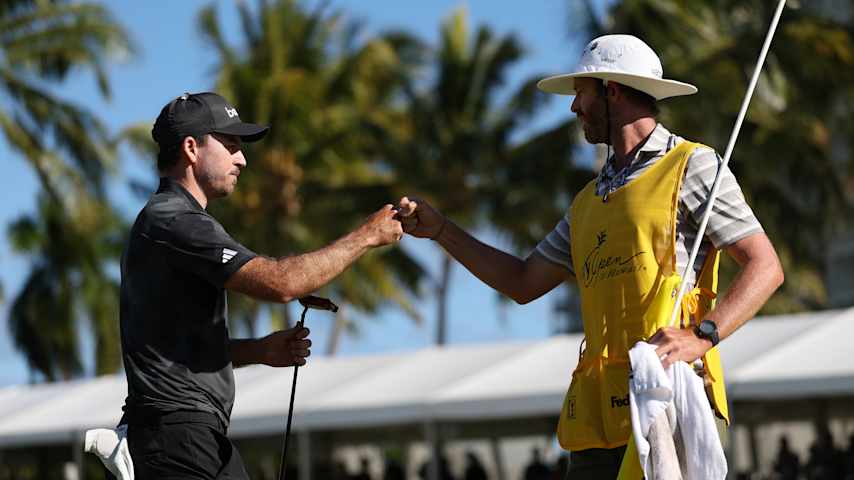 HONOLULU, HAWAII - JANUARY 12: Nick Taylor of Canada reacts with caddie Dave Markle on the 18th green in a playoff during the final round of the Sony Open in Hawaii 2025 at Waialae Country Club on January 12, 2025 in Honolulu, Hawaii. (Photo by Sarah Stier/Getty Images)