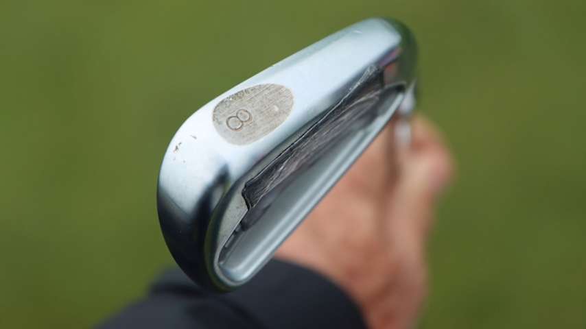 A look at the custom sole and lead tape on Wyndham Clark's Titleist 620 CB irons. (GolfWRX)