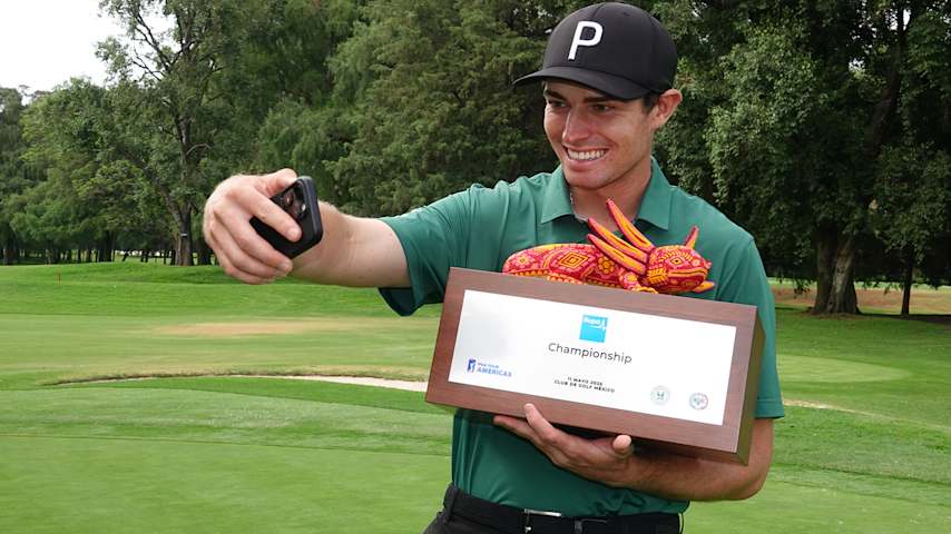 John Marshall Butler takes a selfie with the Bupa Championship trophy after his one-shot win Sunday at Club de Golf Mexico. (Gregory Villalobos/PGA TOUR Americas)