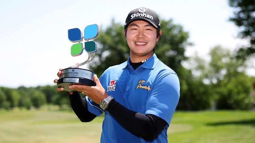 S.H. Kim of South Korea poses with the trophy after winning the AdventHealth Championship 2025 at Blue Hills Country Club. (David Berding/Getty Images)