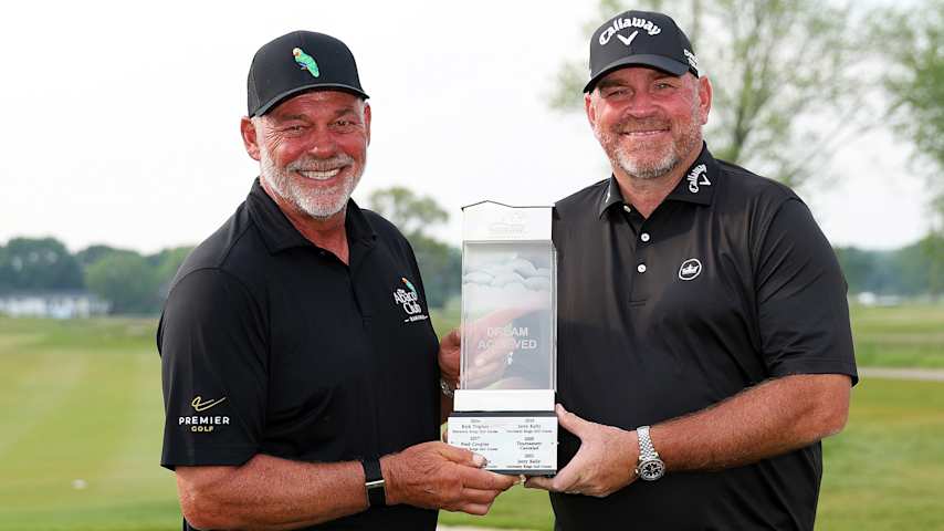Darren Clarke of Northern Ireland (L) and Thomas Bjorn of Denmark pose with the trophy on the 18th hole after winning the American Family Insurance Championship 2025 at TPC Wisconsin. (David Berding/Getty Images)