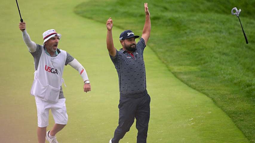 J.J. Spaun celebrates with caddie Mark Carens after holing a 64-foot putt to win the 125th U.S. Open at Oakmont Country Club. (Ross Kinnaird/Getty Images)
