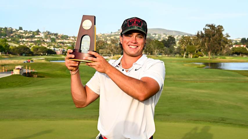 Michael La Sasso poses with the trophy after winning the individual stroke play of the NCAA men's golf championship at Omni La Costa Resort & Spa. (Tracy Wilcox/PGA TOUR)