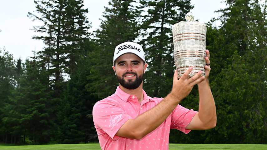David Perkins hoists the trophy after claiming his first career PGA TOUR-sanctioned win at the Explore NB Open.