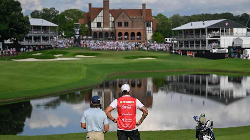 Tommy Fleetwood stands with his caddie, Ian Finnis, on the 18th fairway, during the final round of TOUR Championship at East Lake Golf Club in Atlanta, Georgia. (Ben Jared/PGA TOUR)