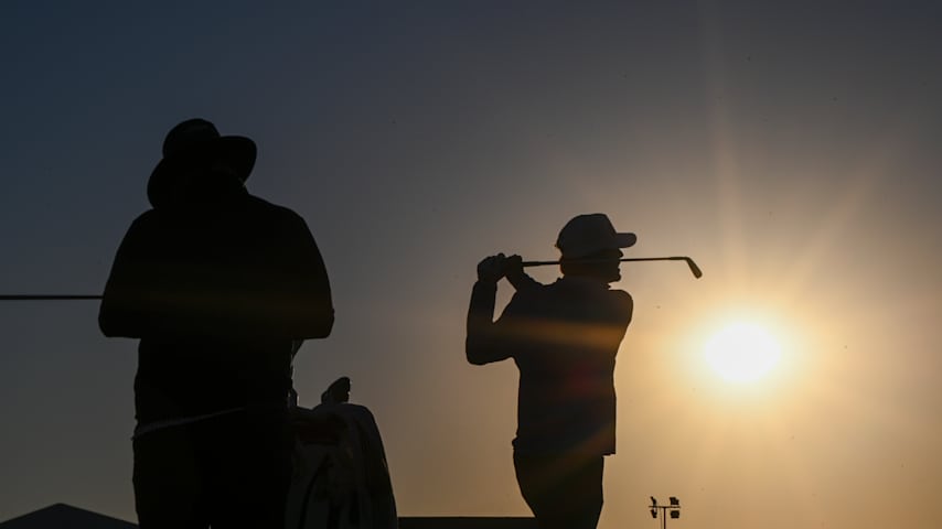 Logan McAllister is silhouetted while hitting balls on the practice range in the morning during the third round of the Korn Ferry Tour Championship presented by United Leasing and Finance at French Lick Golf Resort - Pete Dye Course in French Lick, Indiana. (Tracy Wilcox/PGA TOUR)