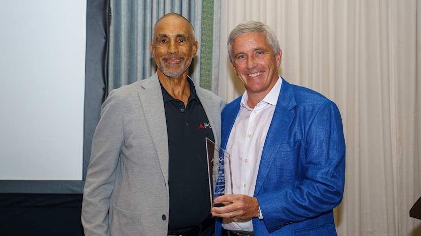 Co-founder and chairman of the APGA Ken Bentley presents PGA TOUR Commissioner Jay Monahan with the Ken Bentley Leadership Award. (APGA)