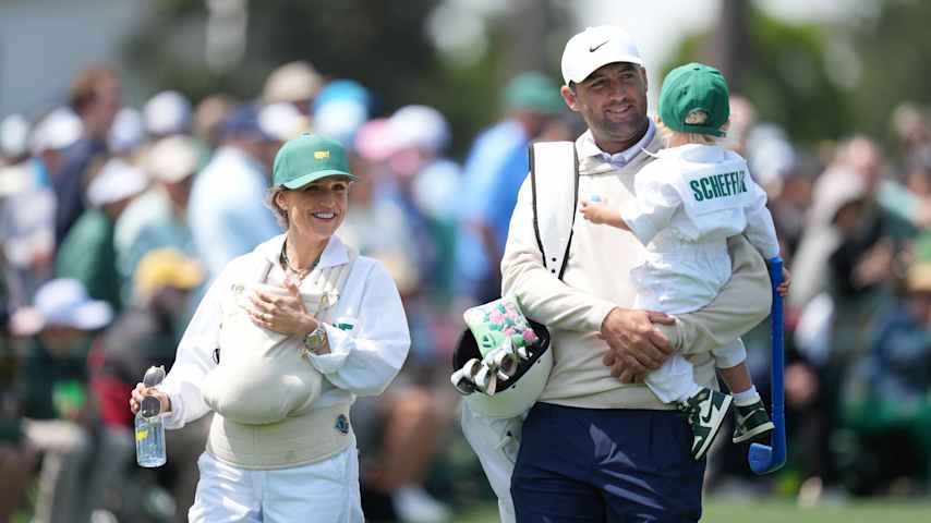 Scottie Scheffler holds his son, Bennett, alongside his wife, Meredith, who is holding baby Remy, during the Par 3 Contest prior to the 2026 Masters. (Ben Jared/PGA TOUR)