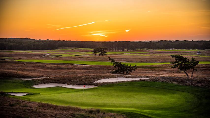 A sunset view of the 14th green during the 2018 U.S. Open at Shinnecock Hills Golf Club. (Keyur Khamar/PGA TOUR)