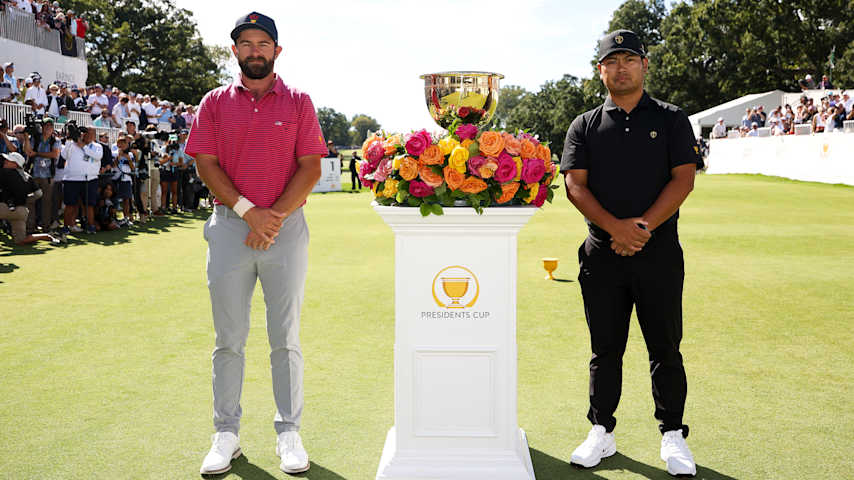 CHICAGO, ILLINOIS - SEPTEMBER 27: Cameron Young of the U.S. Team and Ryo Hisatsune of the International Team pose with the Presidents Cup trophy on the first hole tee box ahead of their singles match during Day Four of the Presidents Cup at Medinah Country Club Course No. 3 on September 27, 2026 in Chicago, Illinois. (Photo by James Gilbert/PGA TOUR via Getty Images)