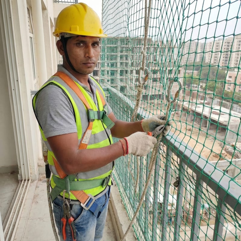 Worker Installing Net