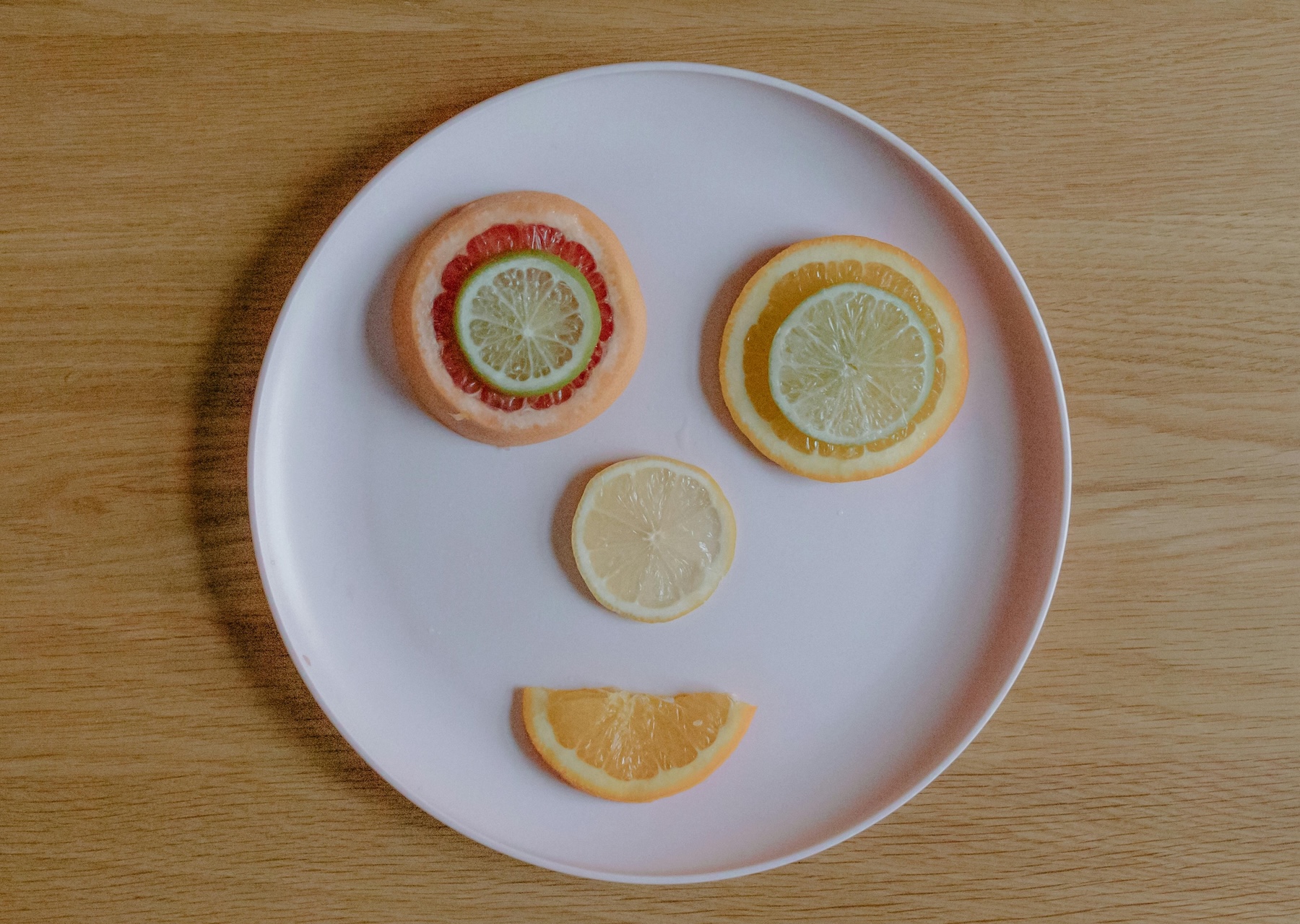Kids meal with sliced citrus fruits.
