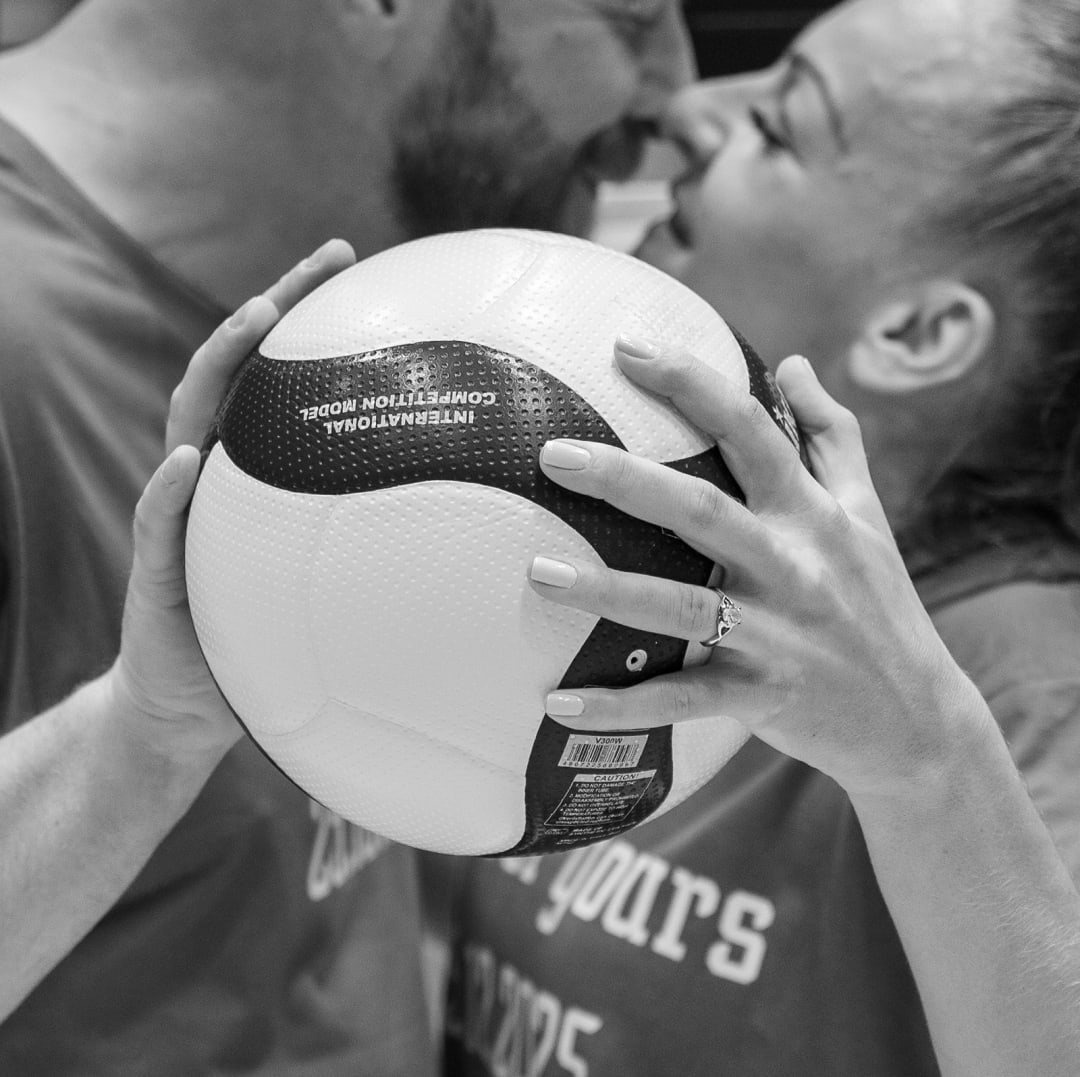 Man, woman engagement ring and ball