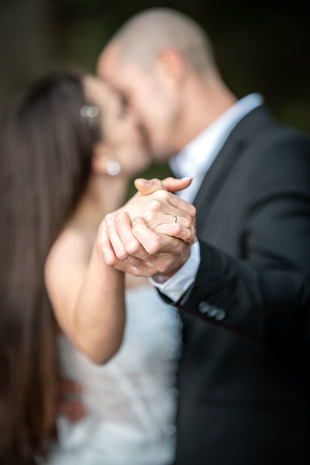 Engagement ring and photo of a couple