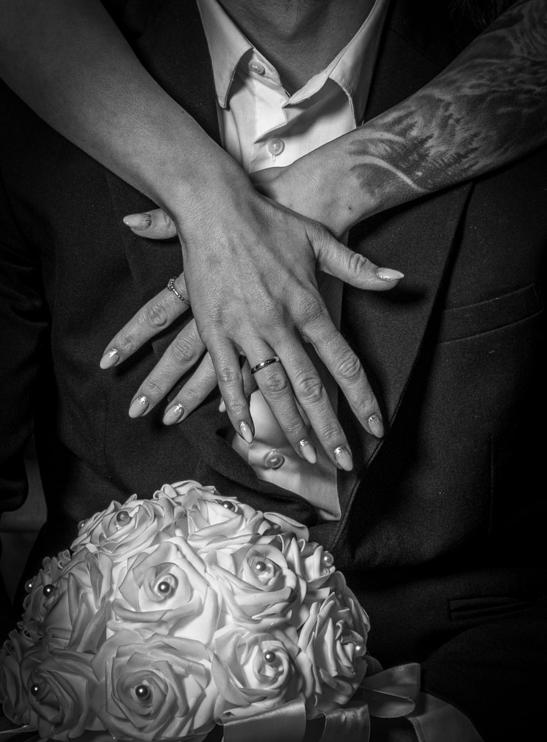 Photo of rings and wedding bouquet