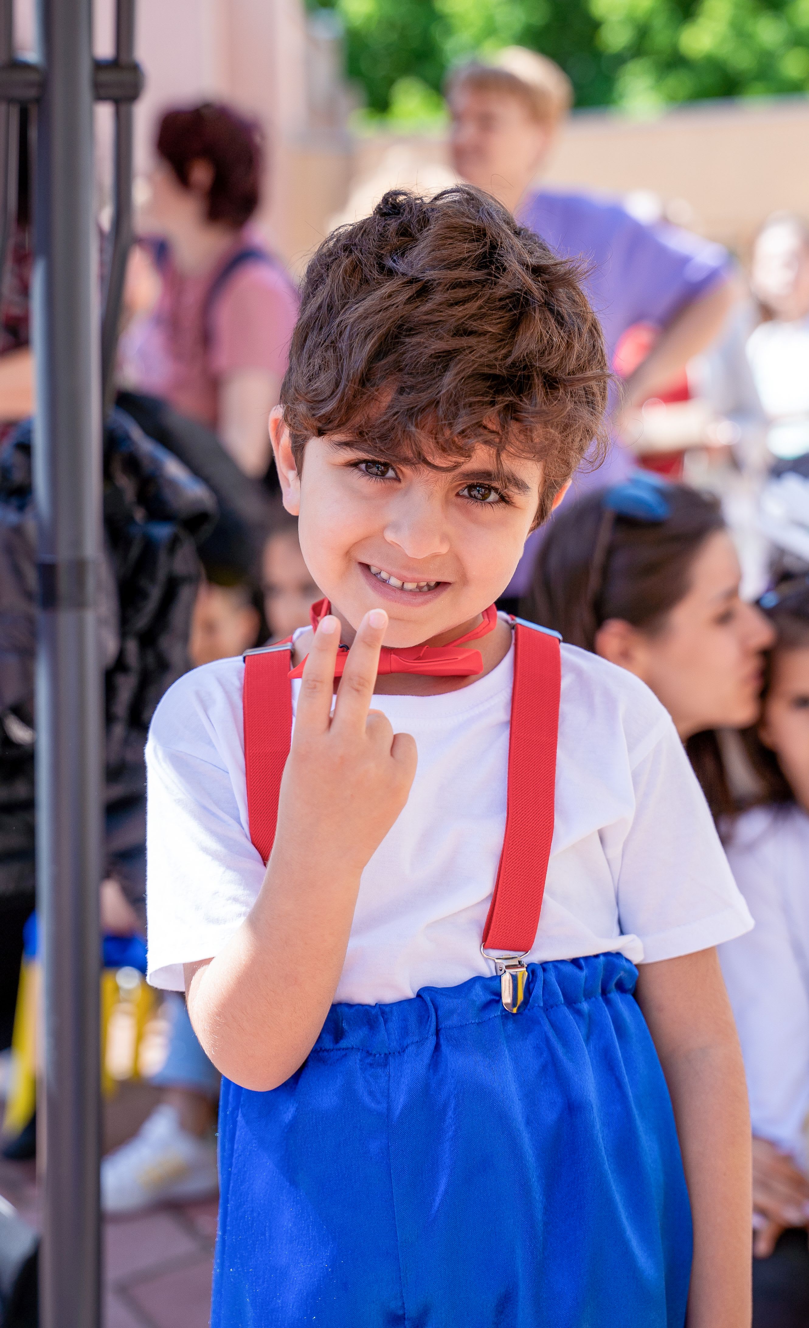 Boy with red suspenders
