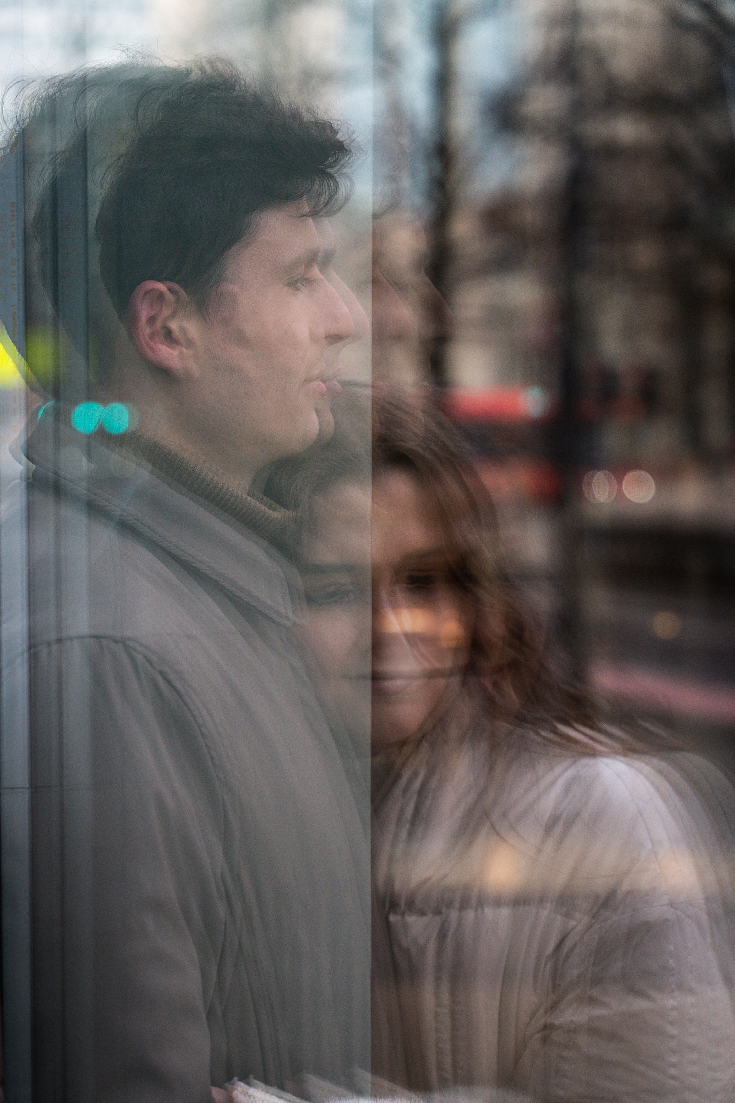 Reflection of couple in café window