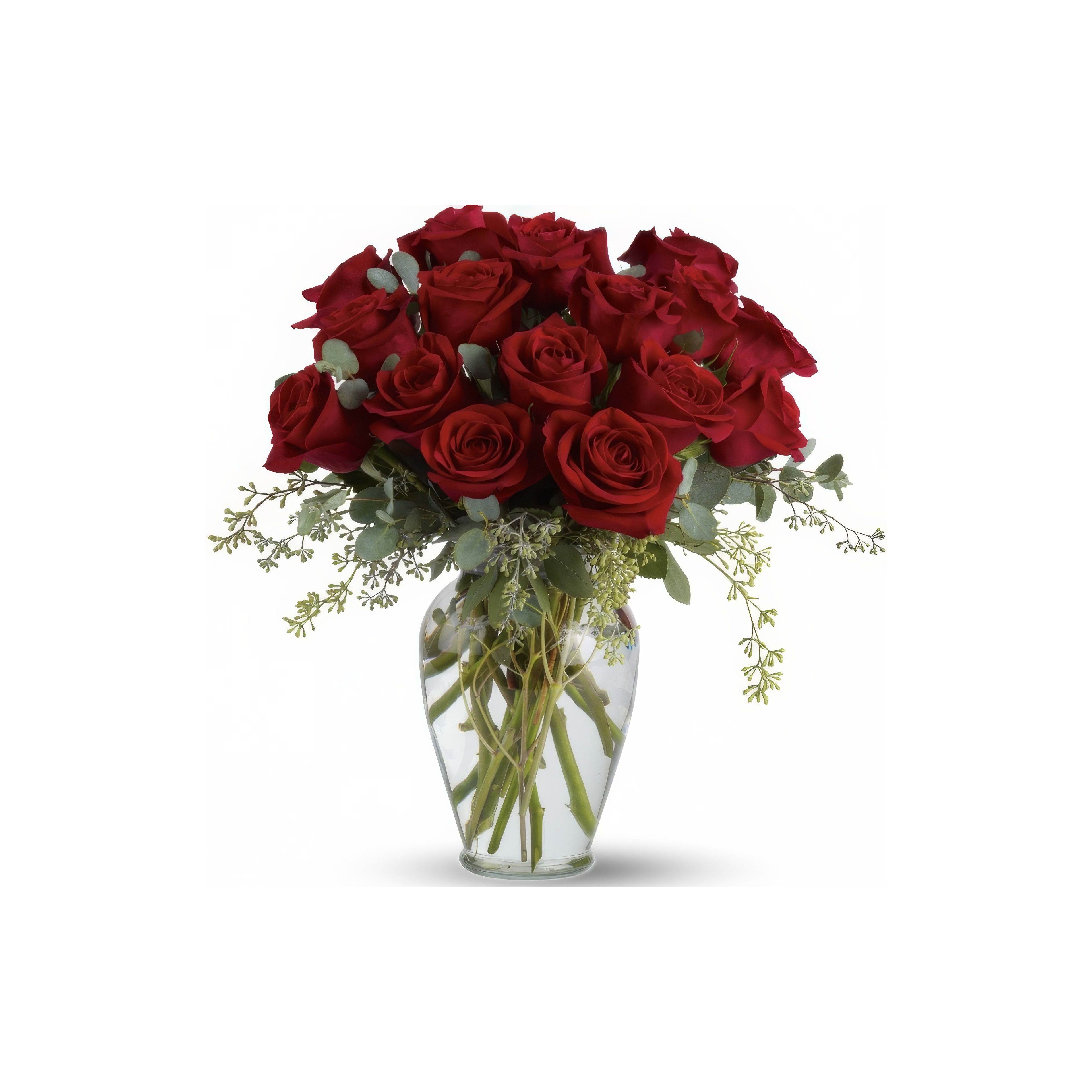 Stunning arrangement of red roses with greenery in a clear glass vase, ideal for various occasions.