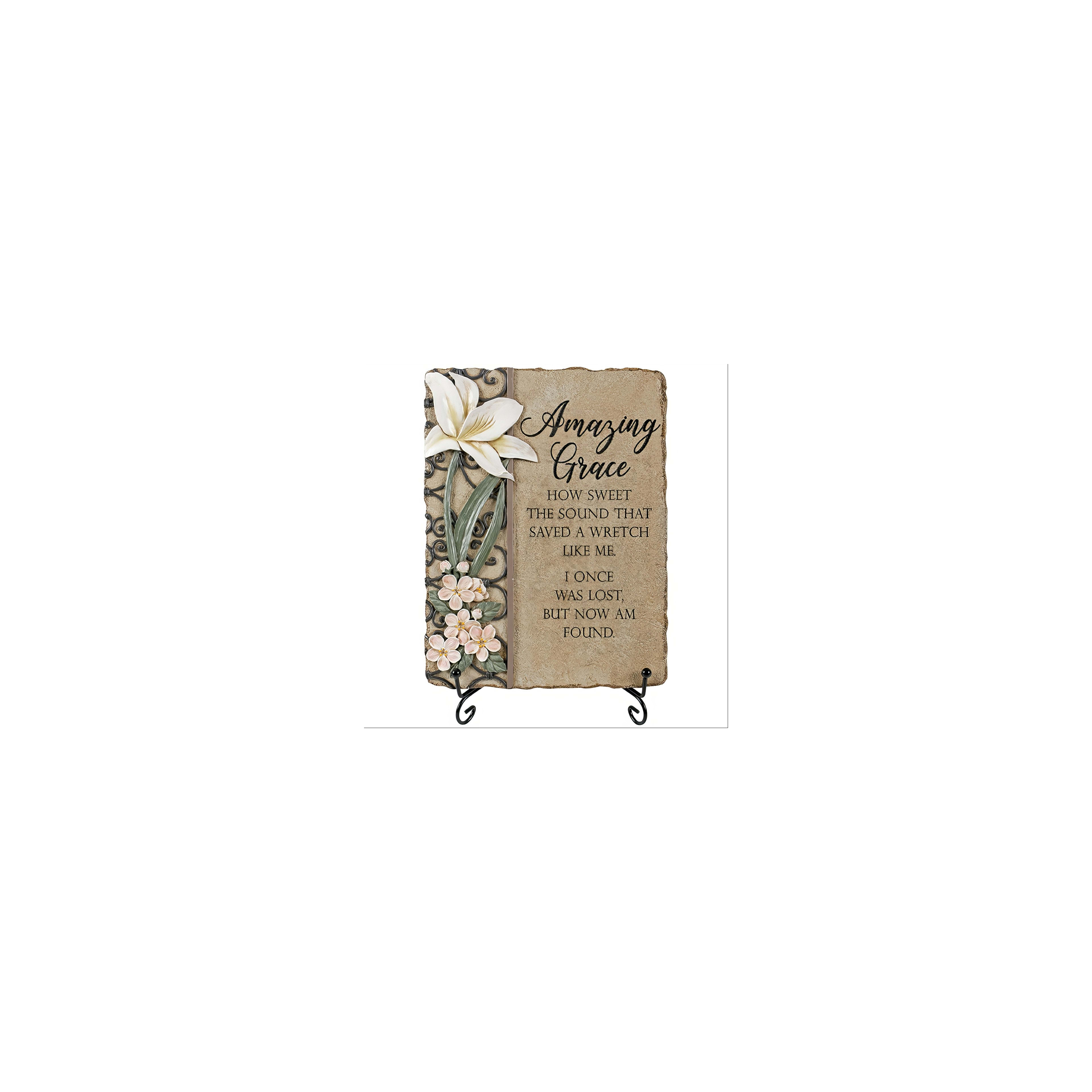 Decorative plaque features the text of Amazing Grace with floral designs on a stone background.