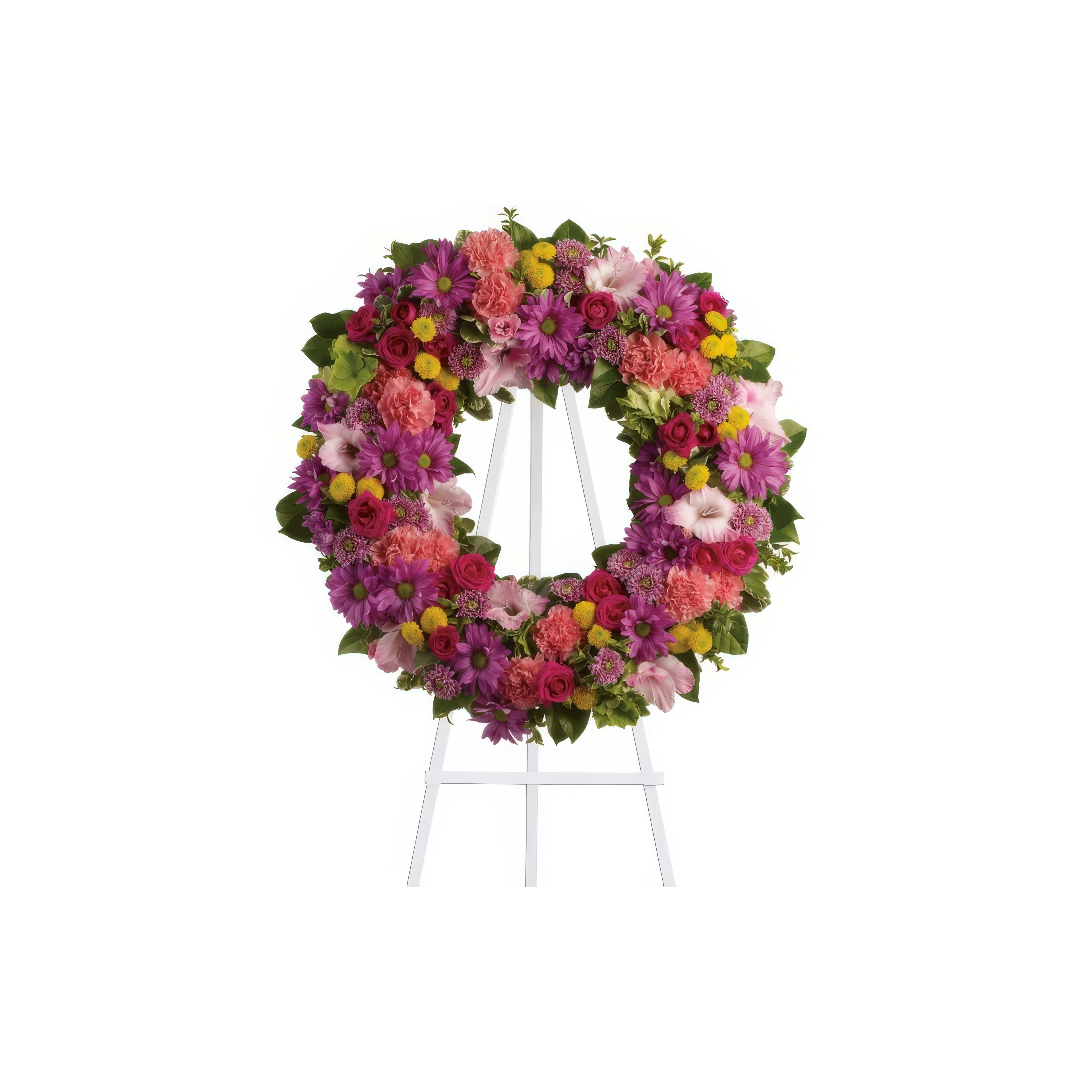 Vibrant arrangement of pink, purple, and yellow flowers displayed on a stand for remembrance.