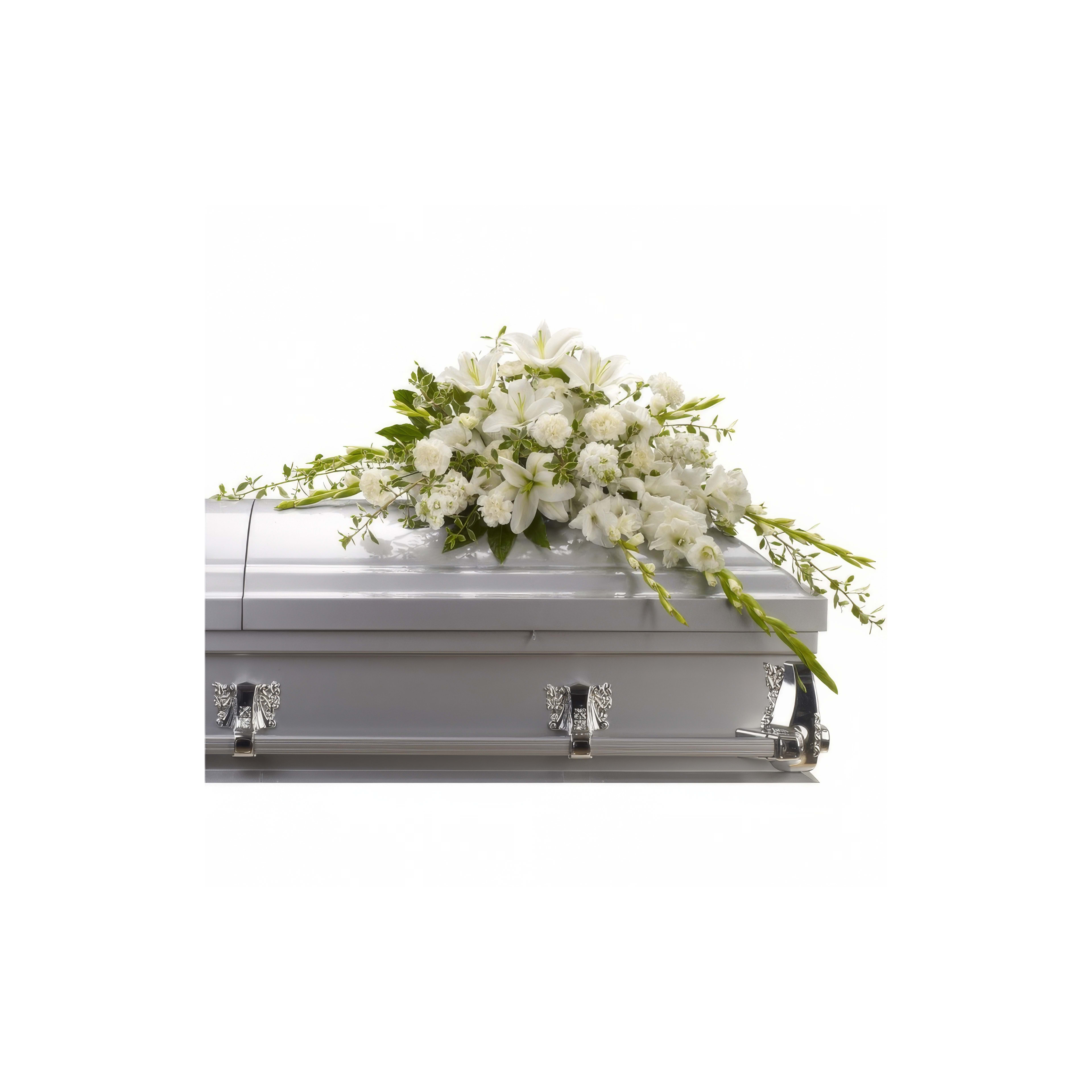 A casket adorned with white flowers symbolizes a respectful farewell at the ceremony.