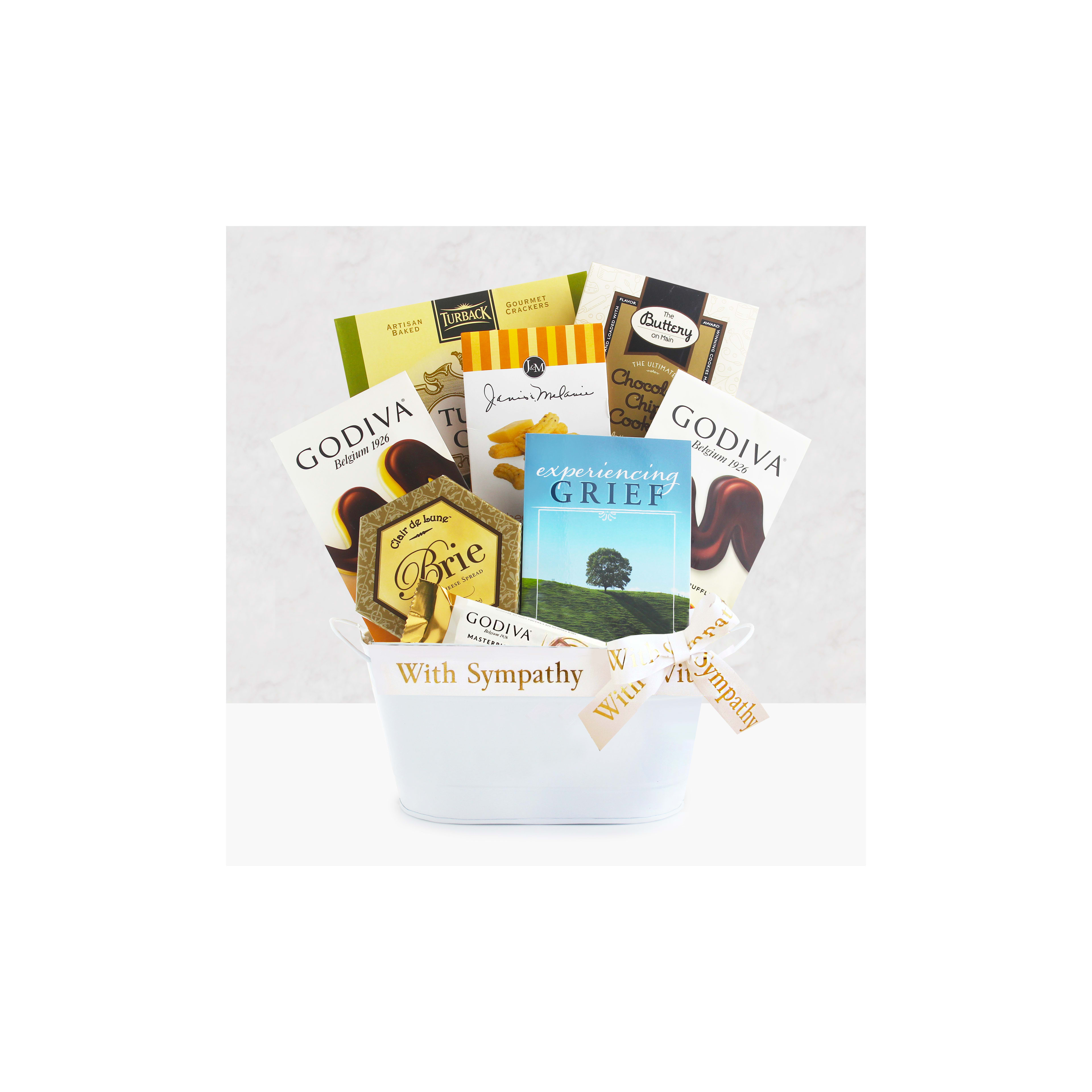 Thoughtful gift basket contains various chocolates and a book offering support during grief.