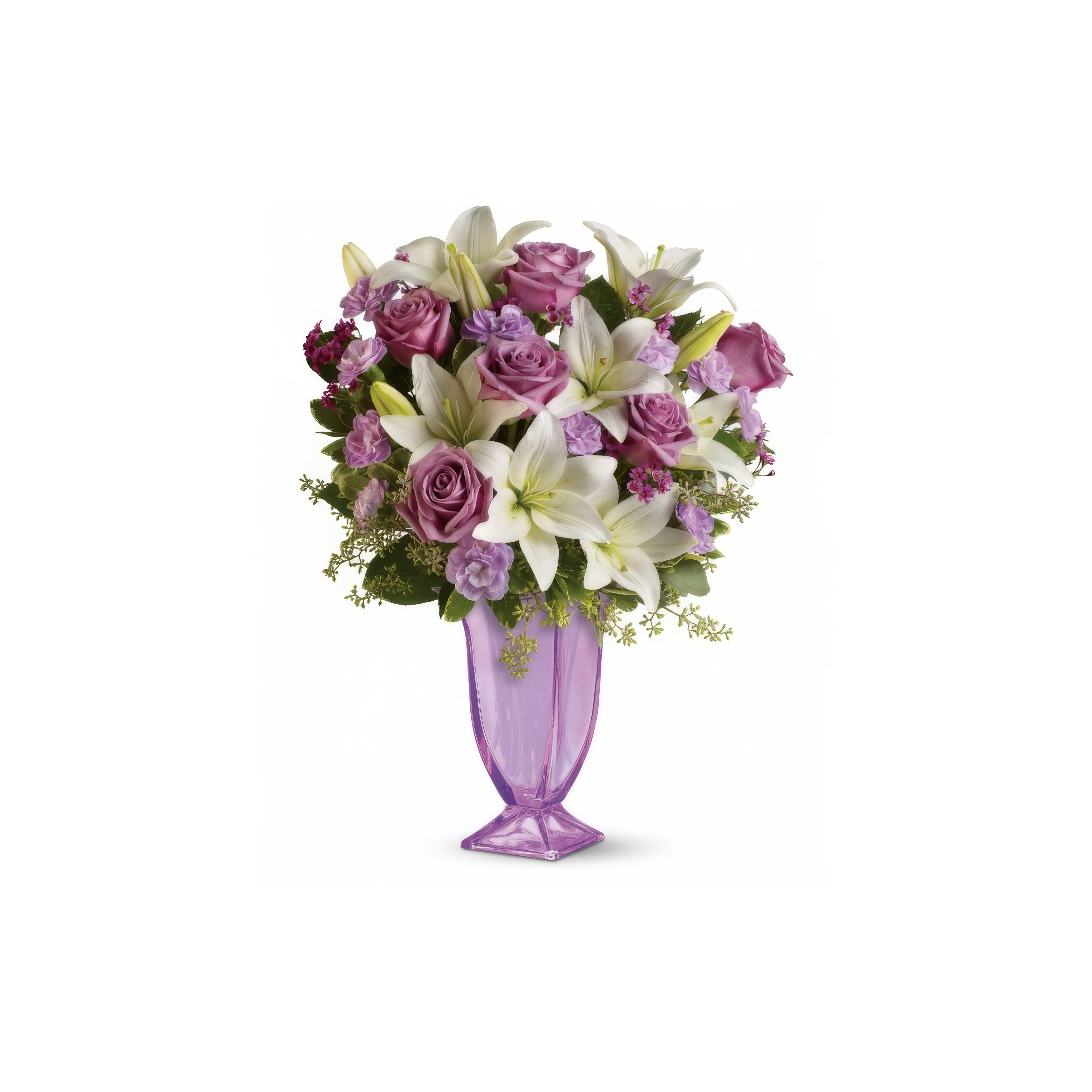 Colorful arrangement of purple roses and white lilies in an elegant vase, perfect for celebrations.