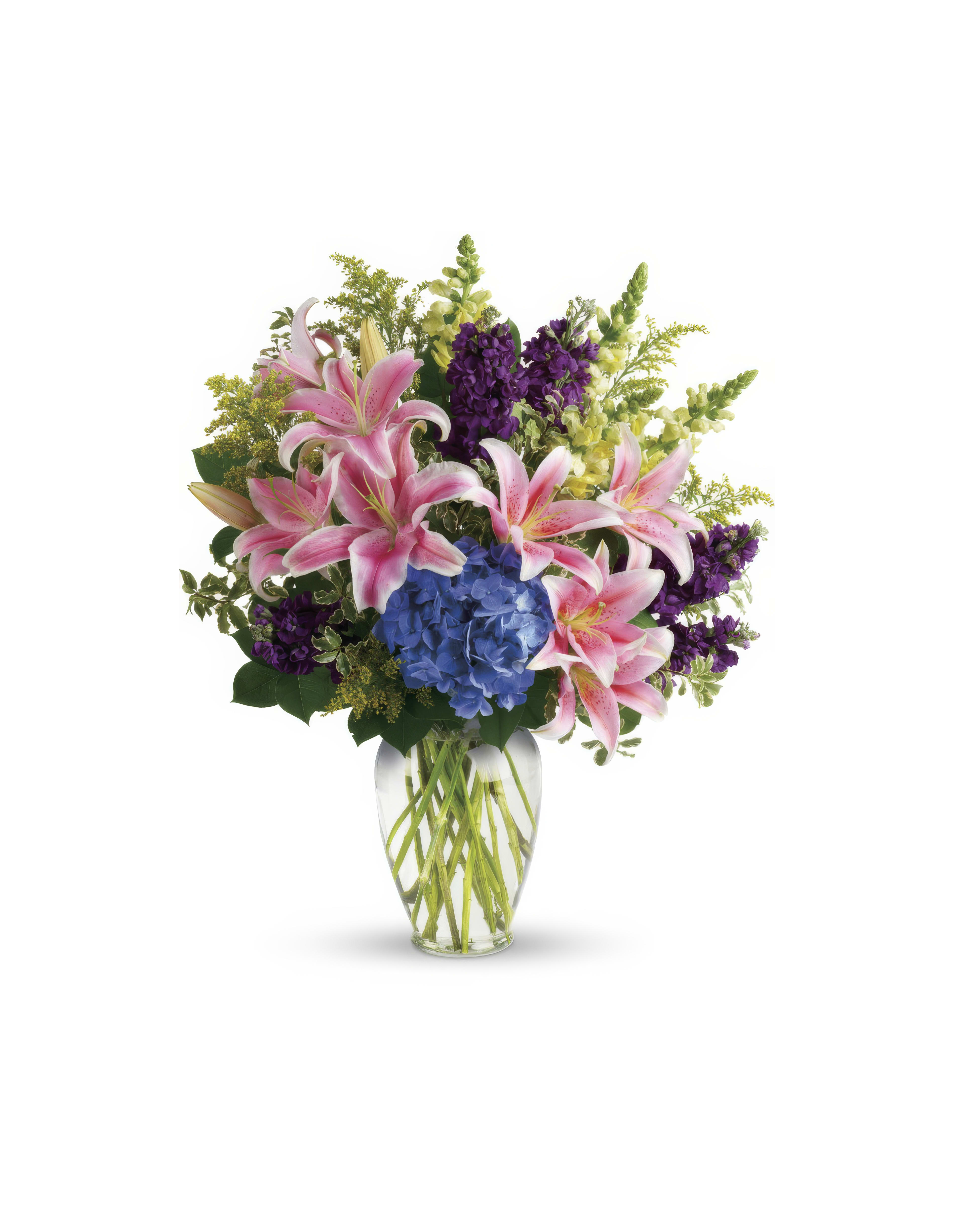 A vibrant bouquet featuring pink lilies, blue hydrangeas, and purple flowers arranged beautifully.