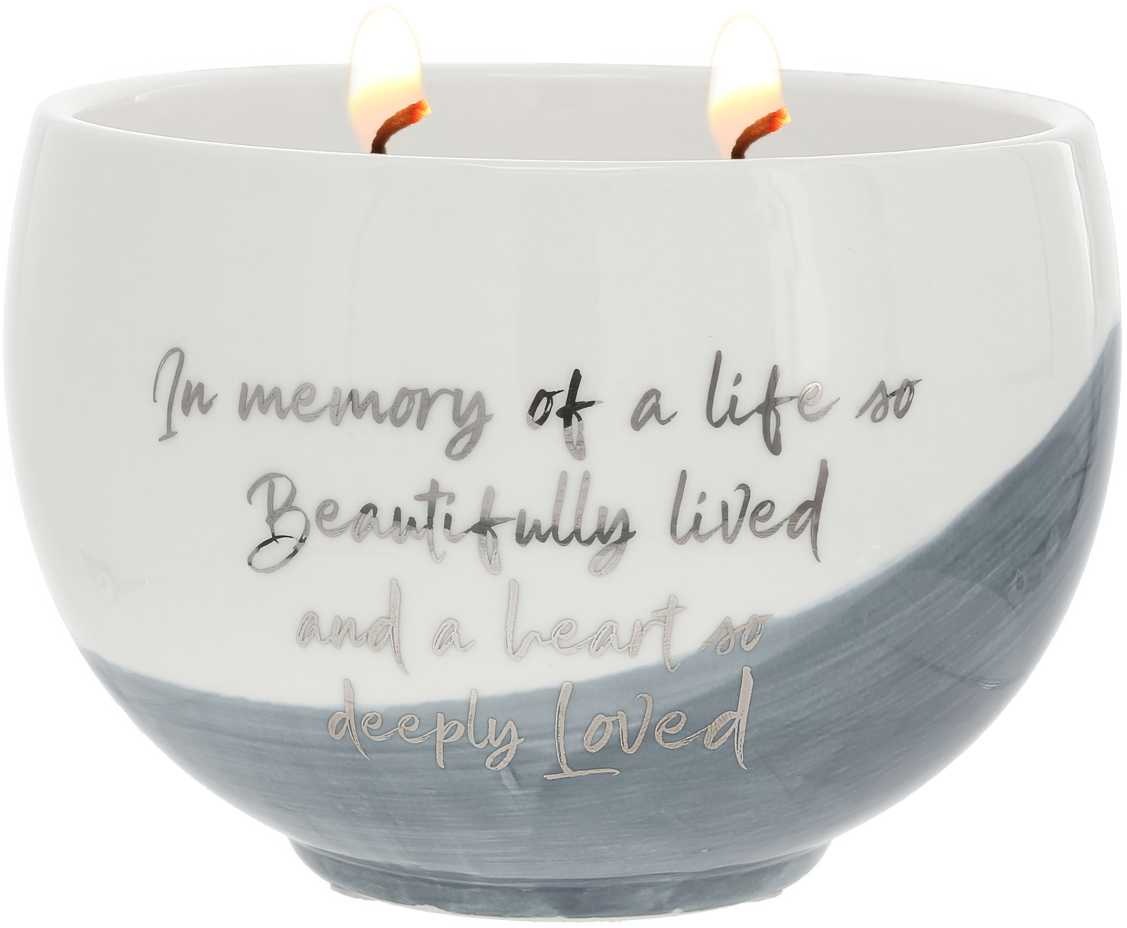 This candle honors a cherished life with a soothing design and gentle colors.