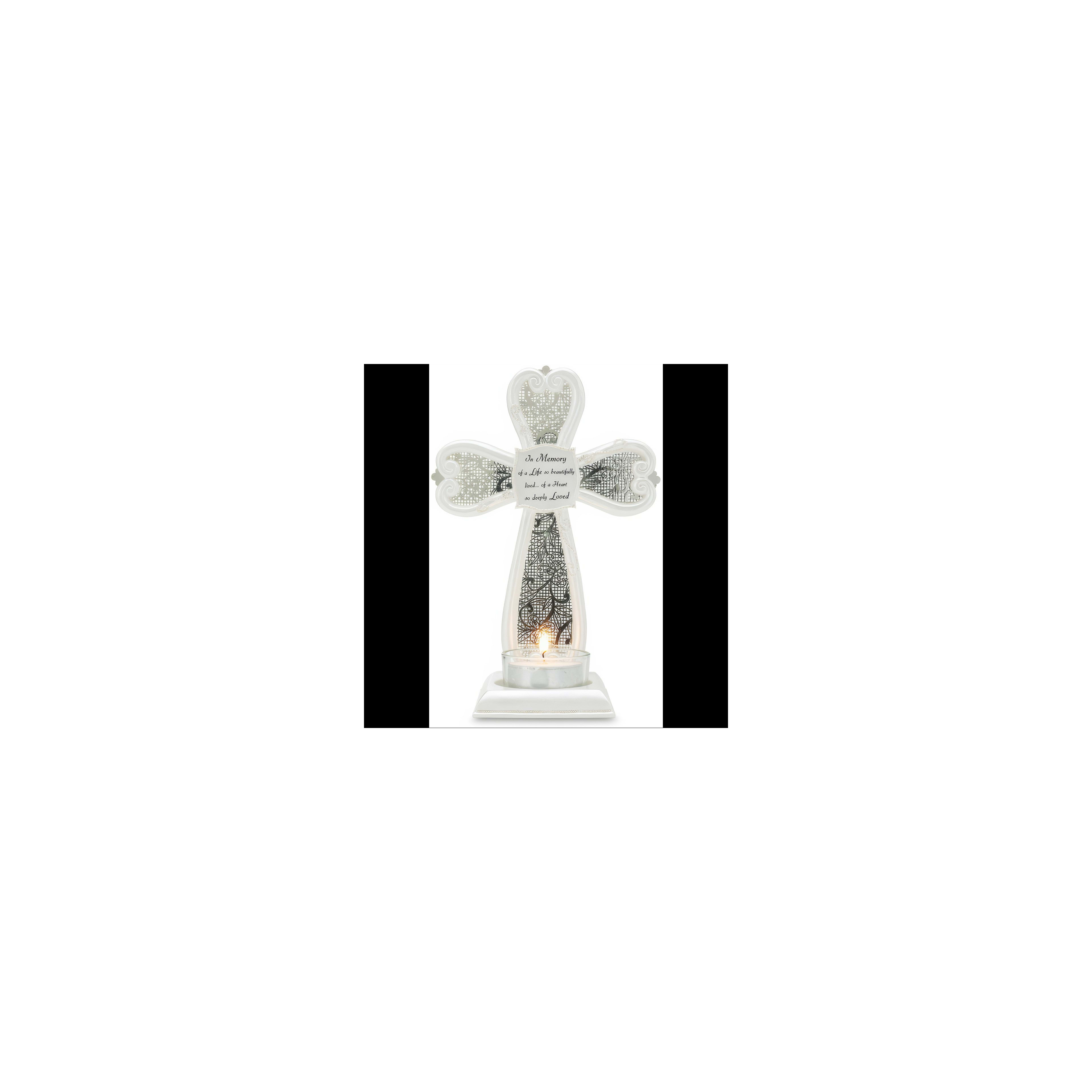 A lovely cross candle holder on a table, illuminated by a warm flame and heartfelt message.