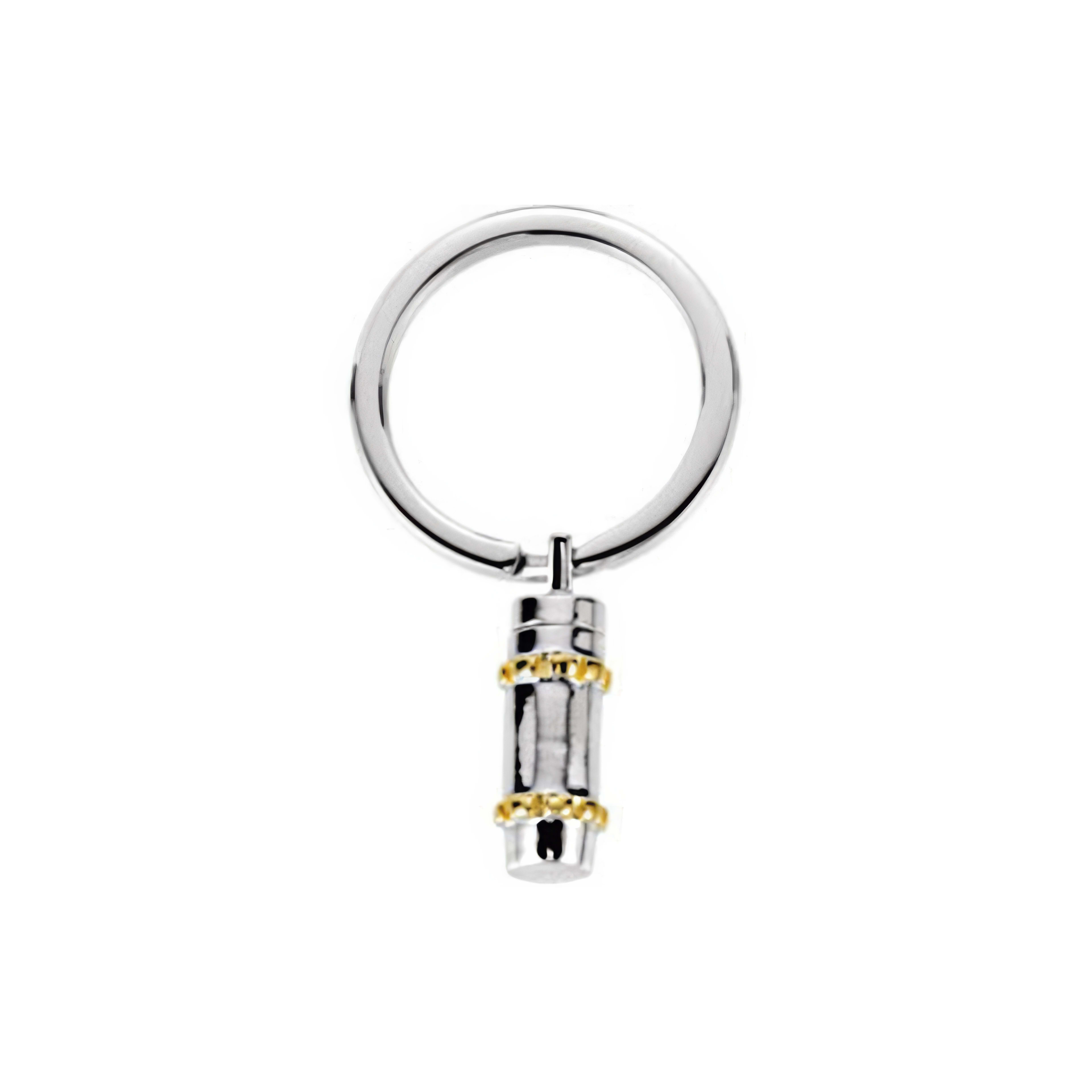 This sleek keychain features a metal ring and cylindrical charm for key organization.