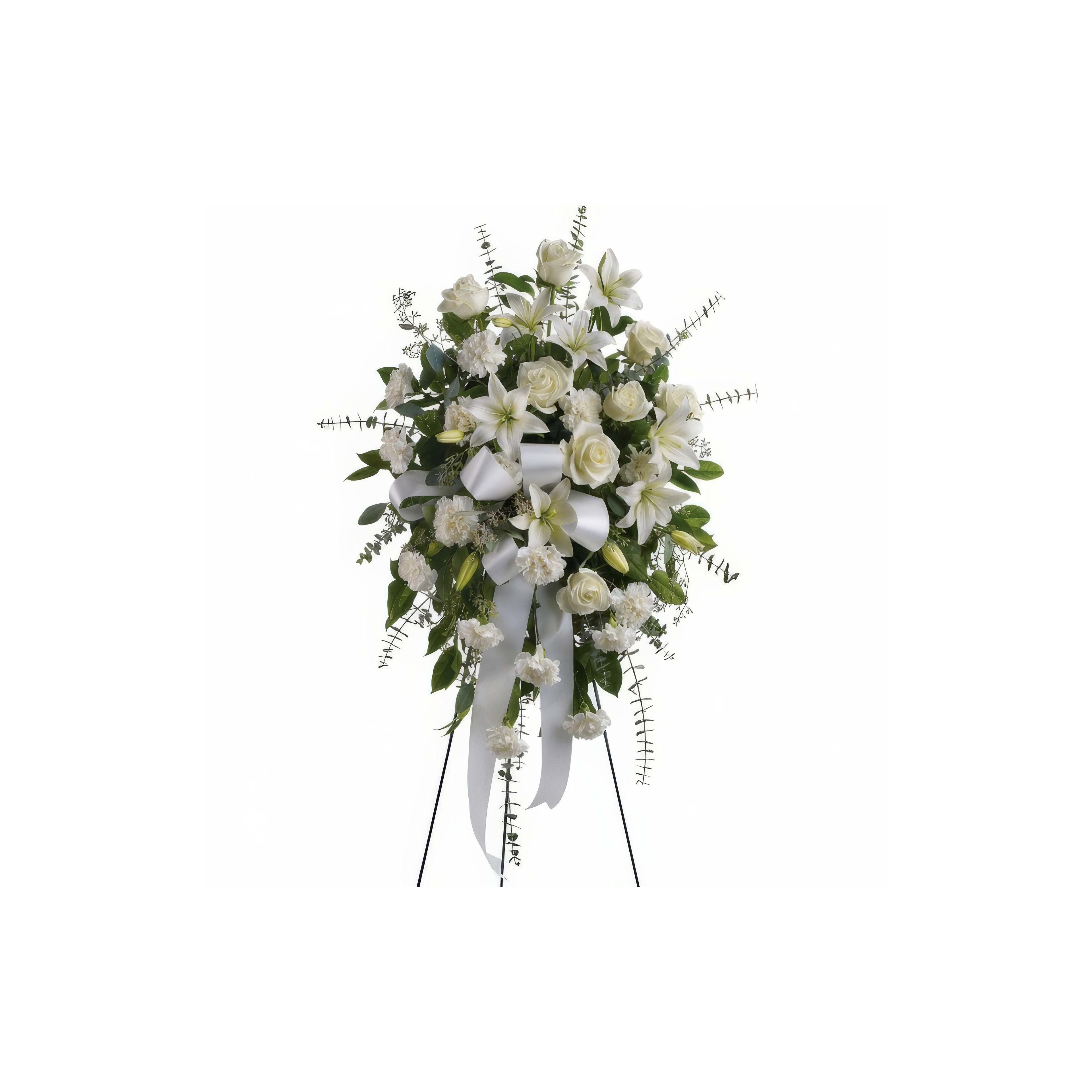 This standing floral arrangement blends white roses and delicate blooms for a special occasion.