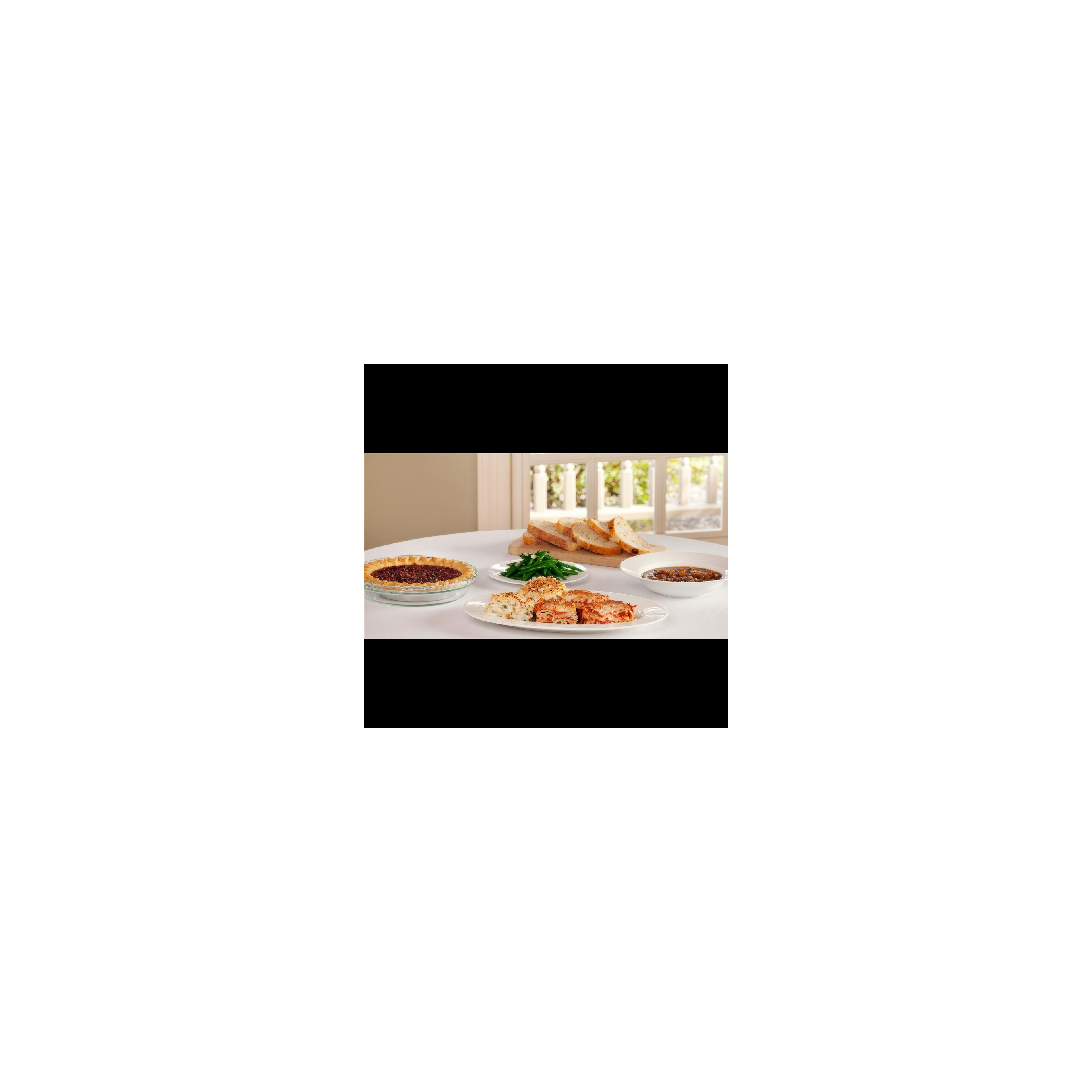 A selection of tasty home-cooked meals displayed on a white table with natural light.