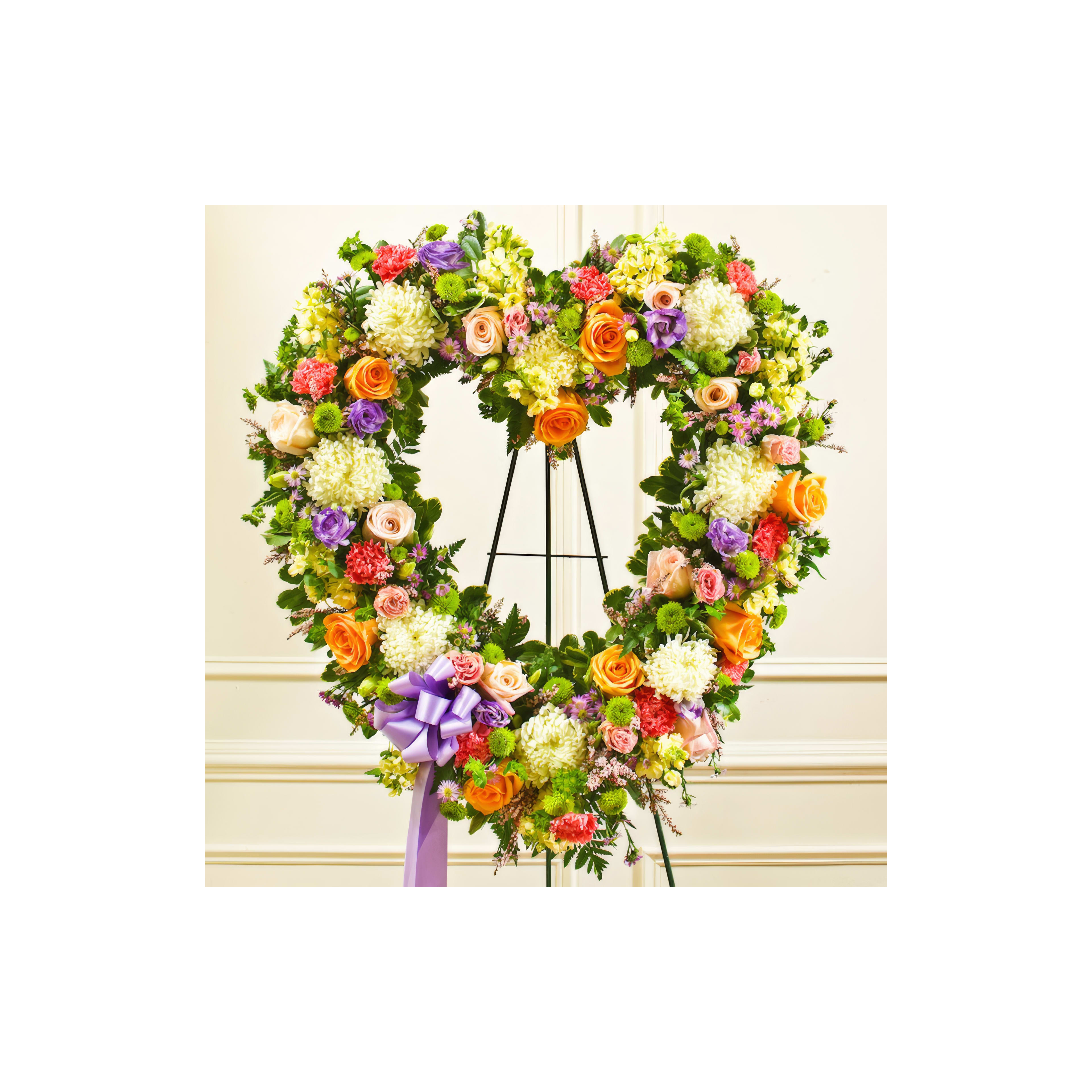 This exquisite heart-shaped floral display features a mix of vibrant flowers arranged gracefully.